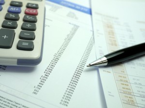 pen and calculator on financial documents