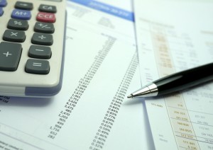 pen and calculator on financial documents